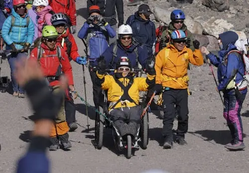 Japanese mountaineer scales mount Fuji at 90 in wheelchair